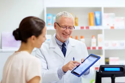 The pharmacist scans your personalised token to access and dispense your medication