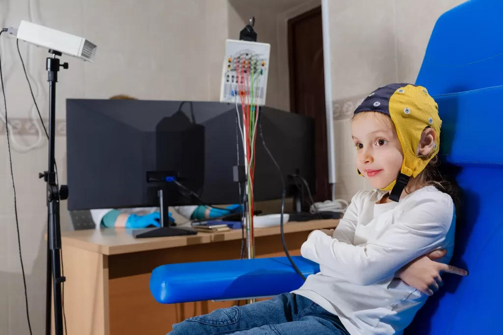 EEG electroencephalogram is conducted in a clinic on a child's head